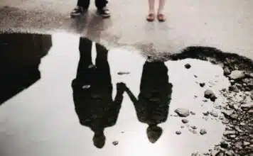 man and woman holding hand together