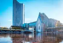 blue and white concrete building near body of water during daytime